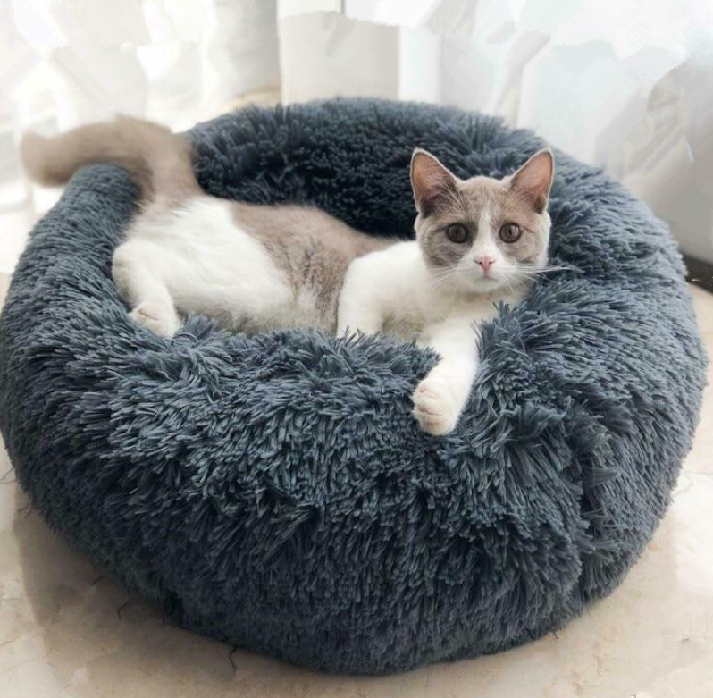 Round plush pet bed with raised edges for dogs and cats - Main product view