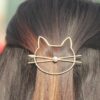 Cute cat-inspired alloy hair clips with pearl detail in silver or gold - Main product view