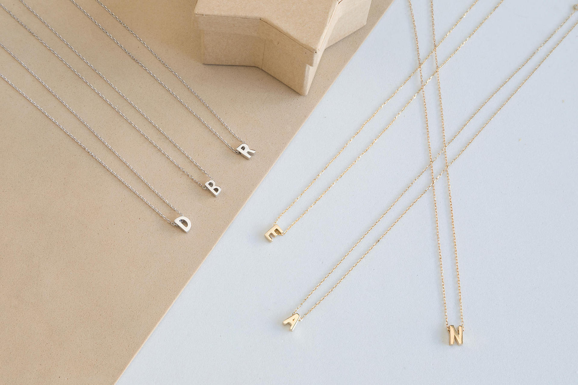 Initial letter pendant necklace with adjustable chain in silver or golden color - Main product view