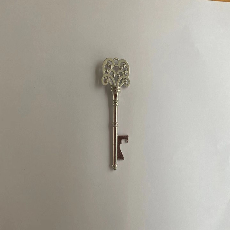 Vintage snowflake-shaped metal keychain bottle opener - Product view 3