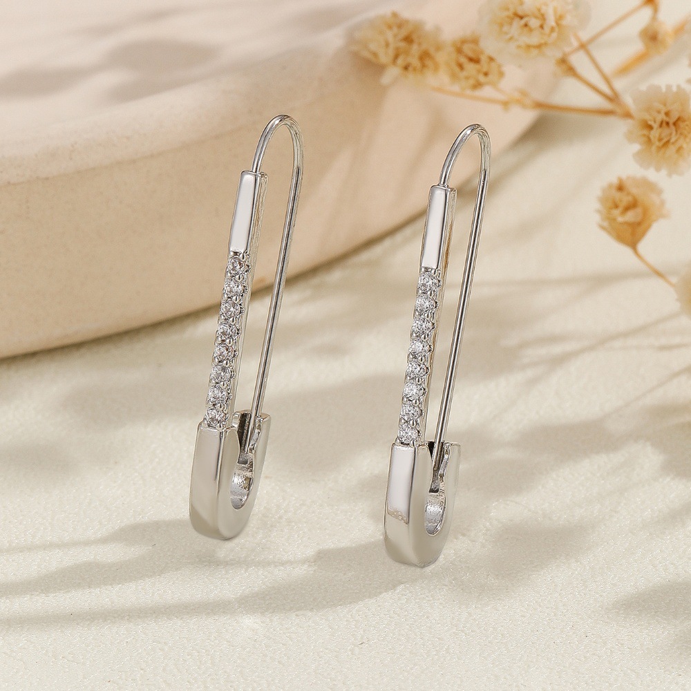 Geometric zircon-style pin clip earrings in a polished metallic finish - Product view 4