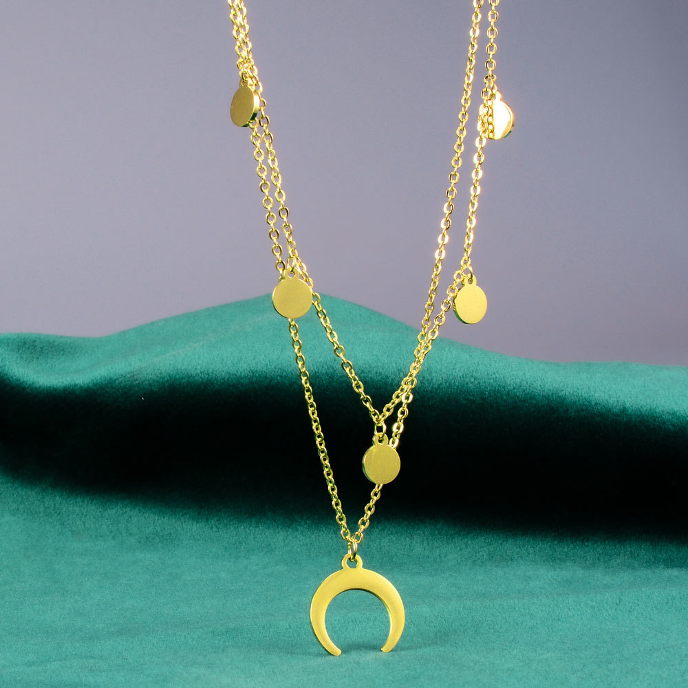 Gold-tone inverted crescent moon and heart necklace with water wave chain - Main product view