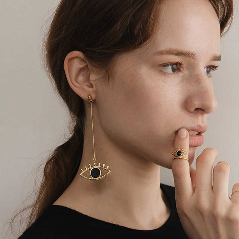 Long devil’s eye anchor cutout drop earrings in gold- and silver-tone options - Main product view
