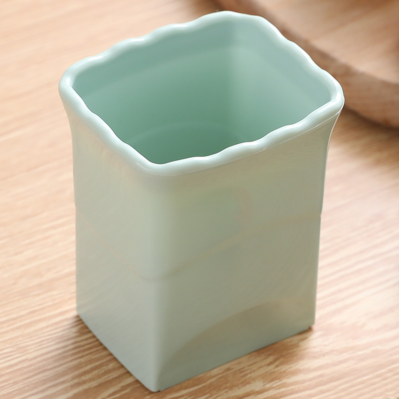 Stainless steel cup-style fruit slicer in a kitchen color option - Product view 3