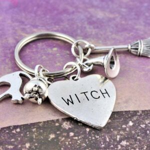 Silver-tone alloy witch hat and broom keychain - Main product view