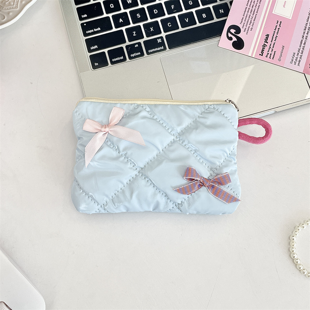 Glossy pearl-style plaid bow coin purse in a soft pastel color - Product view 2