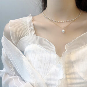Gold-tone double-layer pearl-style necklace with geometric design - Main product view