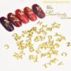 Letter-shaped alloy nail art ornament with crystal detail in gold or silver - Main product view