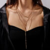Minimalist geometric bar necklace with small dot details in gold or silver - Main product view