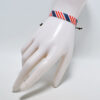 Handmade braided patriotic fabric bracelet with national-flag-inspired style - Main product view