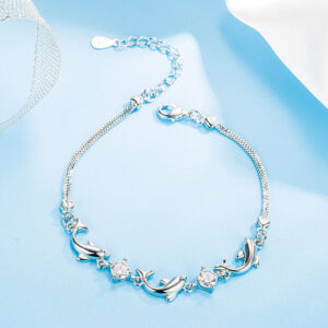 Dainty dolphin bracelet for women with diamond-style inlay and white gold-tone finish - Main product view