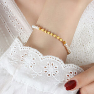 Glossy copper-tone chain bracelet with freshwater pearl detail - Main product view