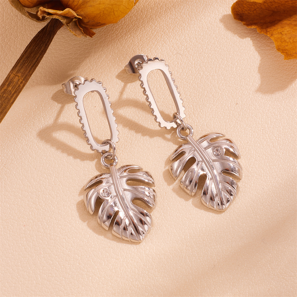 Women's titanium steel leaf, twist, and tassel earrings in gold and silver color options - Product view 4