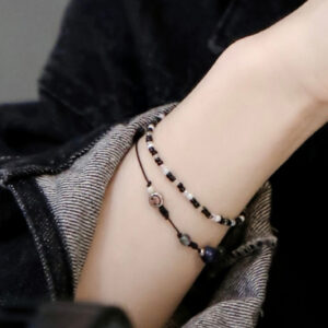 Black thin single-loop crystal beaded bracelet with smiley face detailing - Main product view