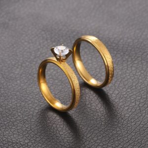 Gold-tone titanium steel couple rings with frosted geometric round design - Main product view