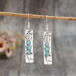 Long geometric drop earrings with turquoise-colored inlay and silver-tone finish - Main product view