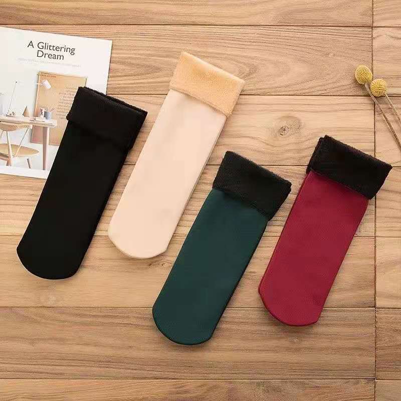 Women's thick plush mid-calf winter socks in a solid color - Main product view