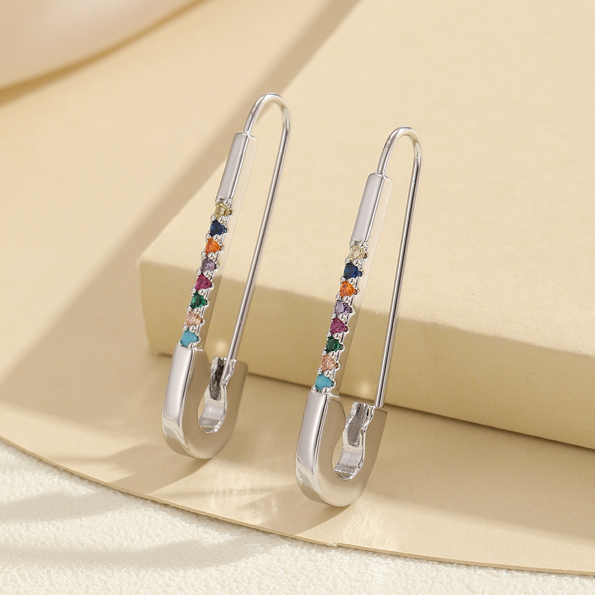Geometric zircon-style pin clip earrings in a polished metallic finish - Product view 7