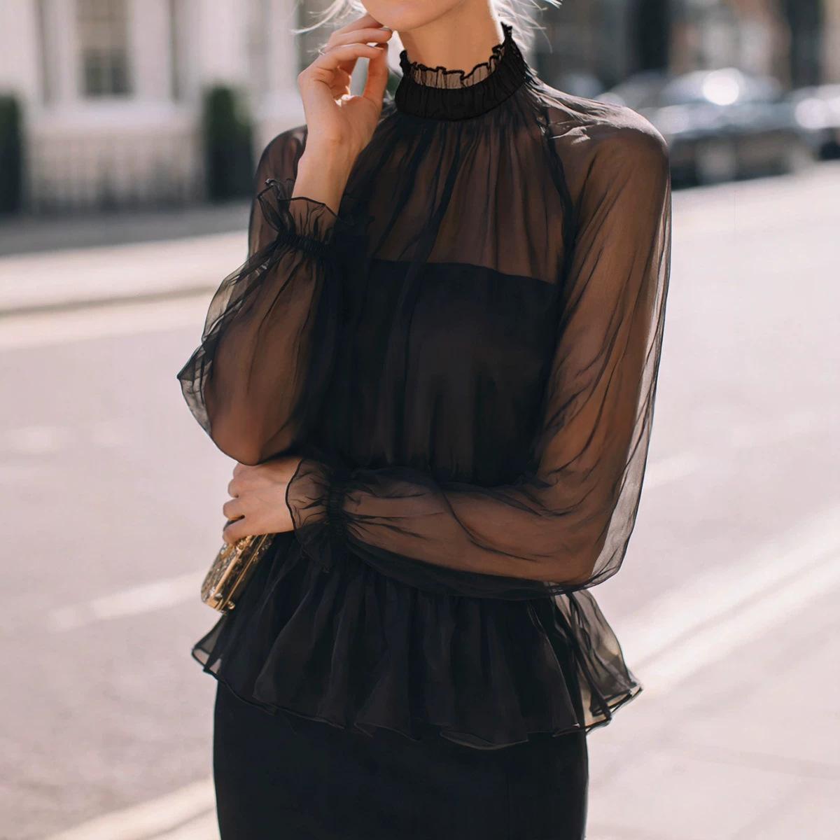 Black long-sleeve top with stand collar and ruffled waist detail - Main product view