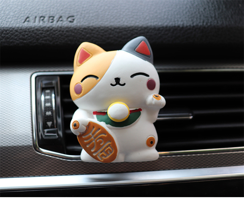 Resin fortune cat aromatherapy clip attached to a car air vent - Product view 12