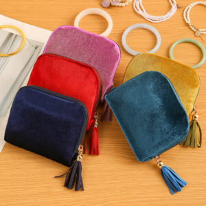 Portable clutch-style velvet jewelry storage bag in assorted colors - Main product view