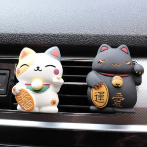 Resin fortune cat aromatherapy clip attached to a car air vent - Main product view