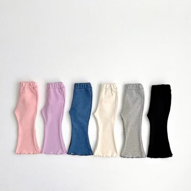 Baby girl cotton mid-waist bell-bottom pants with playful pattern options - Main product view