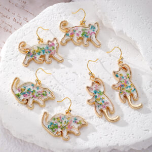 Floral animal dangle earrings with kitten and polar bear designs - Main product view
