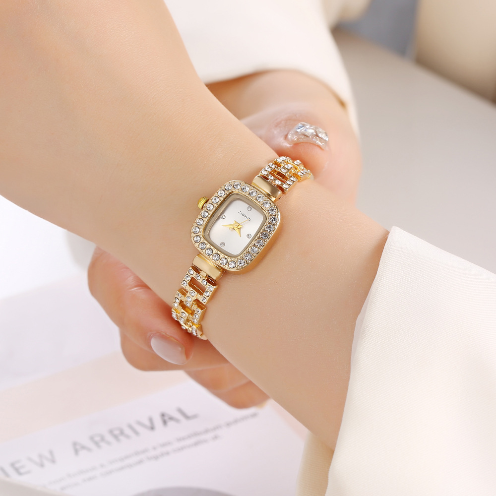 Retractable bracelet quartz watch with elegant decorative accents - Golden White