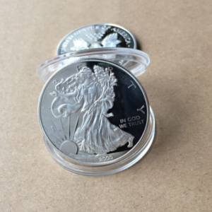 Silver-tone 40mm commemorative coin collectible in an acrylic round box - Main product view