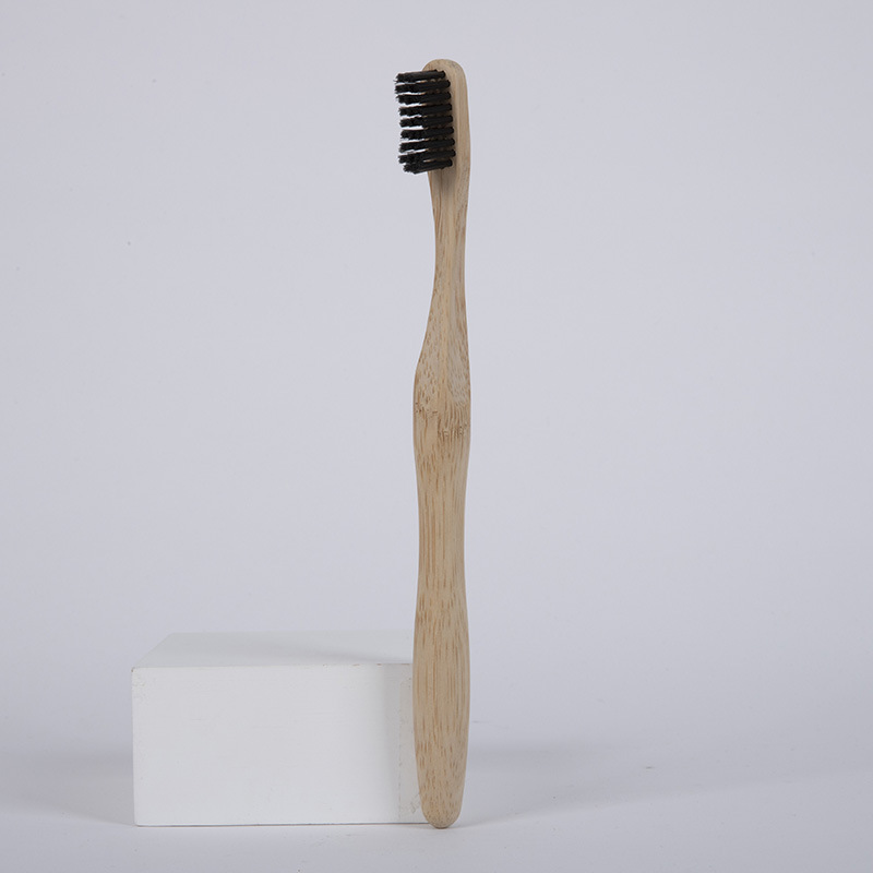 Bamboo toothbrush with a wavy handle and polished smooth finish - Default